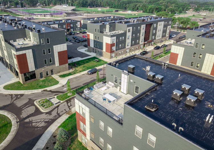 Aerial view of a group of HOM-Flats-affordable housing apartment buildings.